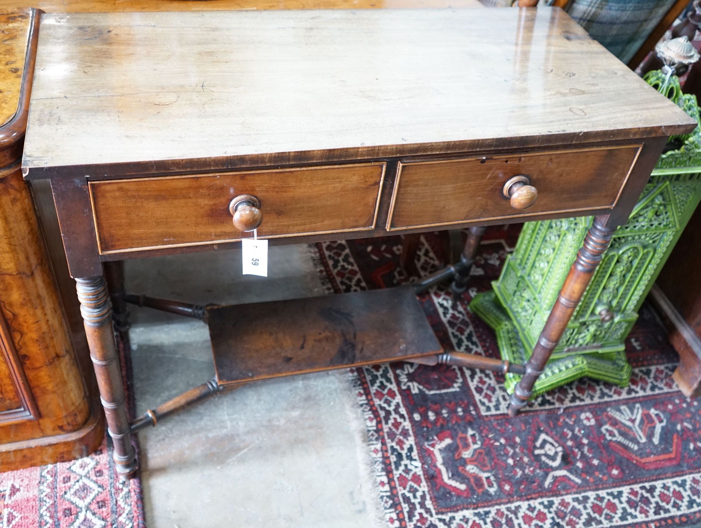 A Regency faded mahogany two drawer side table, width 92cm, depth 41cm, height 77cm